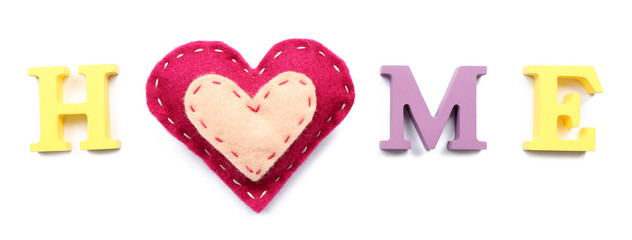 Decorative letters forming word HOME with heart isolated on white