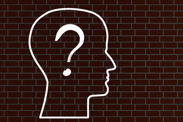 Head with question mark on a brick wall