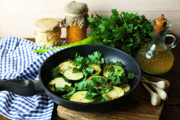 Sliced zucchini in pan on table, closeup
