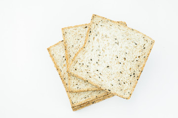 Fresh sliced wholewheat bread with various seeds and multigrain on isolated white background