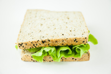 Fresh sandwich made from wholewheat of various seeds and multigrain in isolated white background