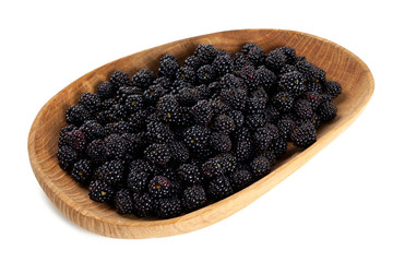 blackberrries in a bowl isolated on white