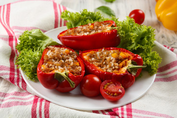 Stuffed peppers with vegetables on table close up