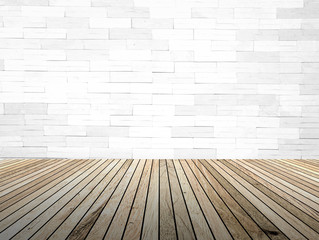 perspective wood plank floor with over blur Brick wall backgroun