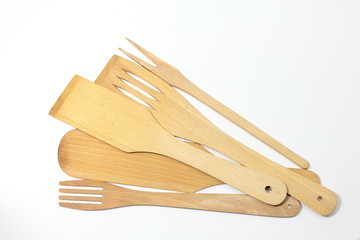 Wooden spoons, spatulas and a fork isolated on white background