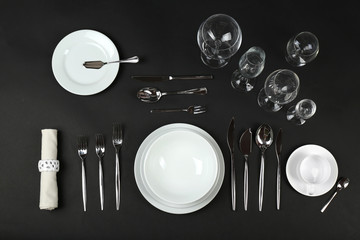 Table setting, close up, on black background
