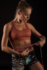 sexy woman in fitness wear with tape