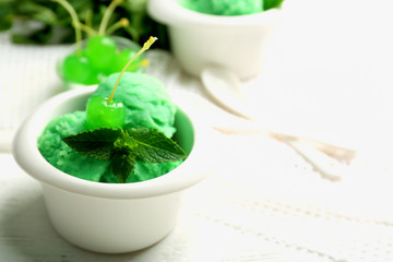 Homemade mint ice-cream on light wooden background