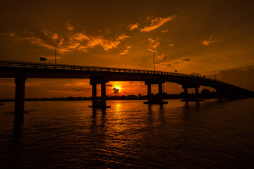Silhouetted of Bridge over the river in Thailand.