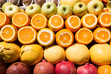 Pomegranates, apples and oranges at street market
