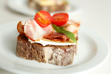 Tasty sandwiches on plates, close up