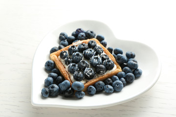 Gourmet fresh blueberry tart on plate, close up