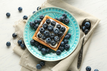 Still life with gourmet fresh blueberry tart