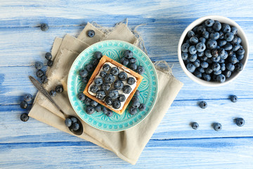 Still life with gourmet fresh blueberry tart