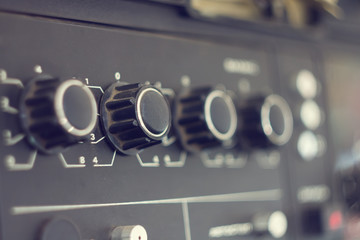 Piece of electrical audio equipment with knobs