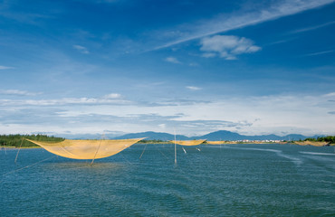 Fish net on Hoai river at Hoi An, Danang, Vietnam.  Hội An is recognized as a World Heritage Site by UNESCO.