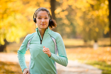 Woman jogging and listening music