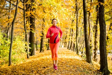 Poster Woman jogging and listening music © Martinan