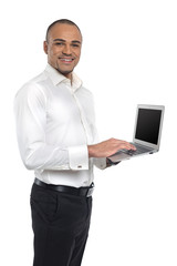 Businessman holding laptop