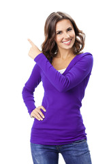 Beautiful young woman showing, on white
