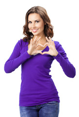 Obraz na płótnie Canvas Woman showing heart symbol gesture, isolated