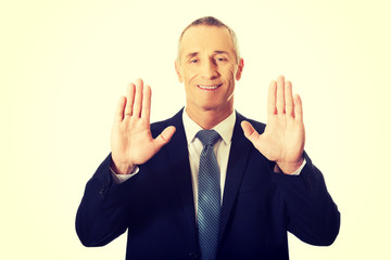 Businessman pressing abstract screen