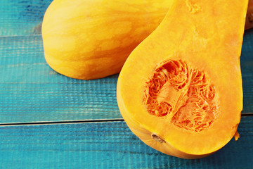 Muscat pumpkin on blue rustic background. Seasons, autumn vegetables