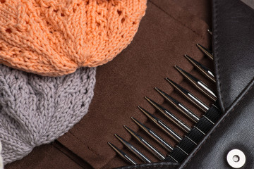 Handmade knitted hats with knitting accessories