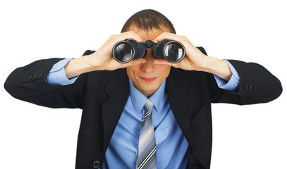 Business man wearing suit with blue tie with binoculars