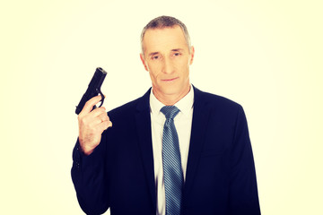 Naklejka premium Serious mafia agent with handgun