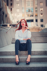 Fototapeta premium Fashion redhead young woman