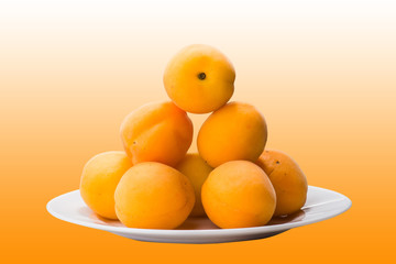 yellow peach slices on plate isolated on yellow