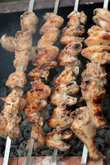 Chicken on the grill to cook