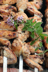 Chicken on the grill to cook