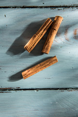 cinnamon sticks on wooden background