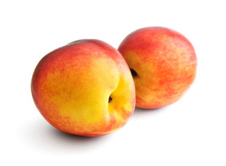 two peaches isolated on white background