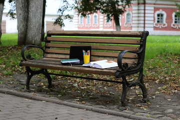 books on a bench in the school year