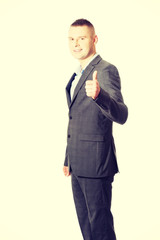 Young businessman gesturing ok sign