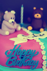Fototapeta na wymiar birthday cake with bears and flowers