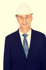 Smiling businessman with hard hat
