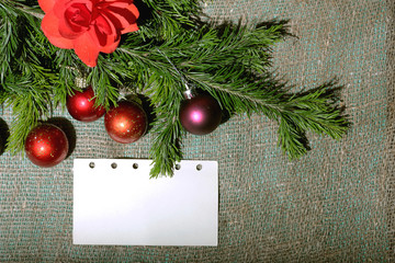 Fototapeta na wymiar Christmas toys and Christmas tree with a piece of paper