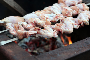 Chicken on the grill to cook