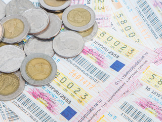 Thai lottery tickets and coins