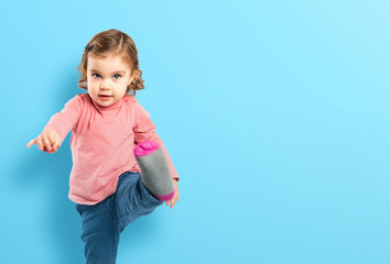 Little girl walking over white background