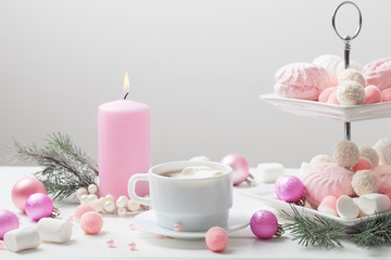 Christmas table with cup of coffee and dessert