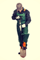 Mature gardener with a spade