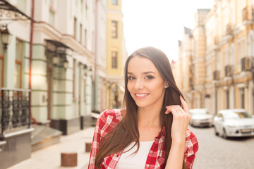 Fototapeta premium beautiful girl walks in the city