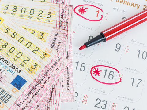 Close up Thai lottery tickets and Thai calendars
