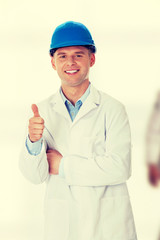 Man in a lab coat and helmet