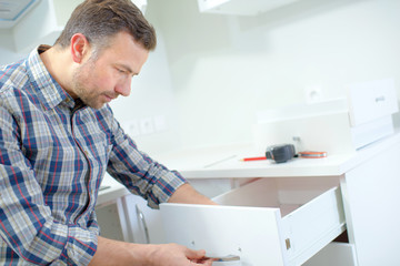 Man assembling furniture